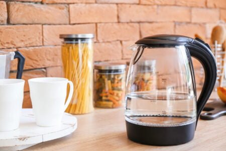 Electric kettle with water in kitchen