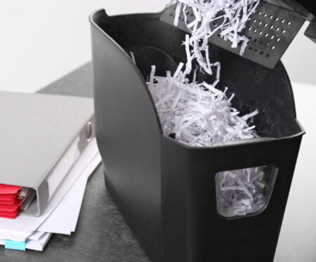 Emptying the bin of a paper document shredder
