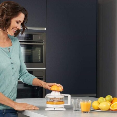 Electric Press Citrus Juicer On Countertop in the kitchen