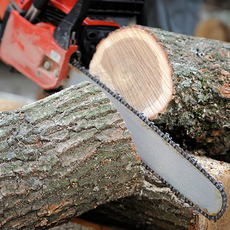Powerful electric chainsaw at work
