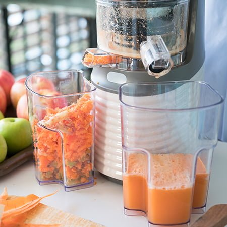 Vegetable and fruit juice healthy with slow masticating juicer machine