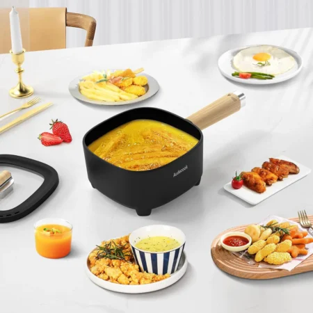 Multifunction electric hot pot cooking fresh vegetables and meat, showing versatility in the kitchen Multifunction electric hot pot cooking fresh vegetables and meat, showing versatility in the kitchen